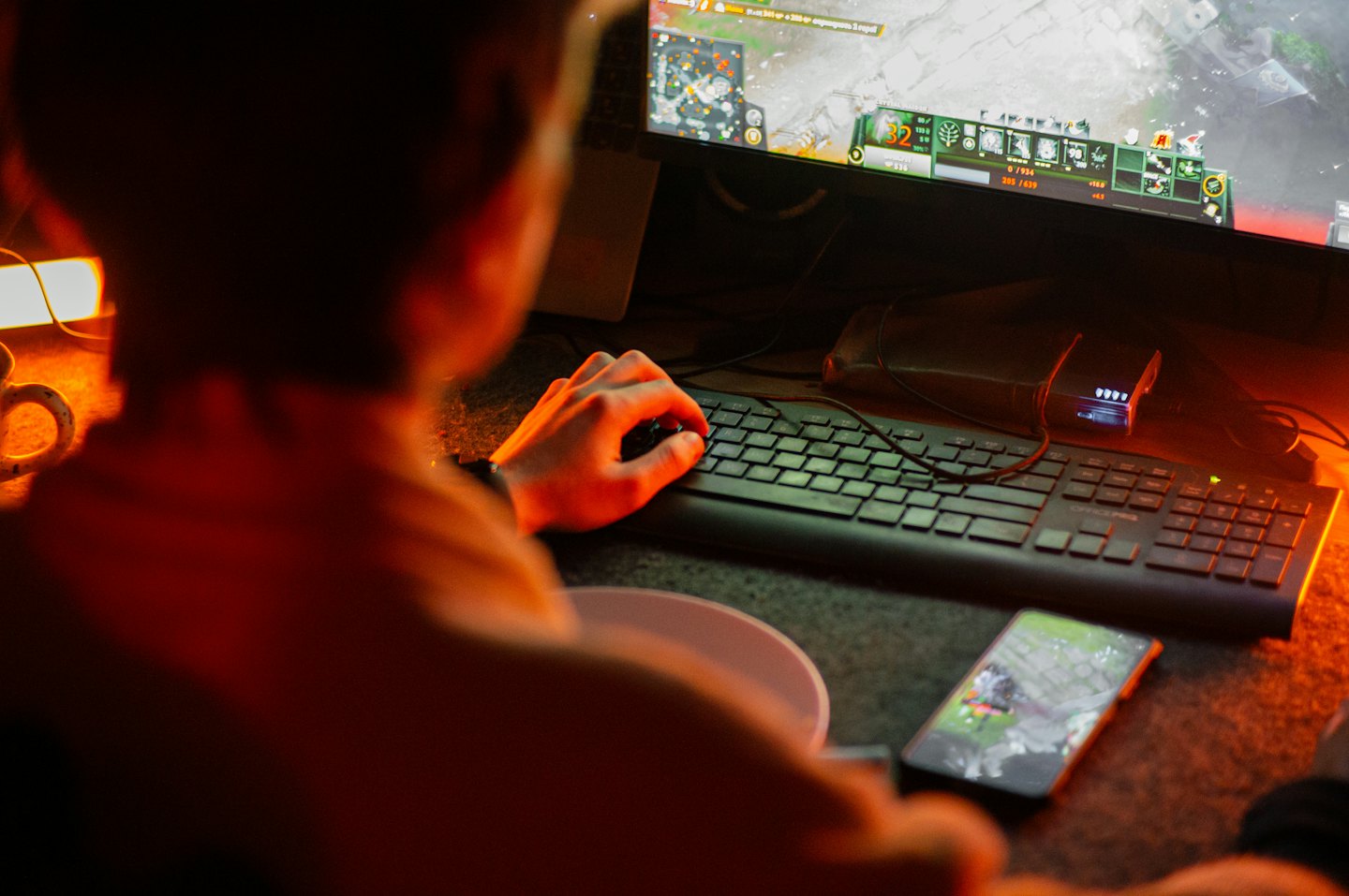 Person playing a video game on a computer monitor.